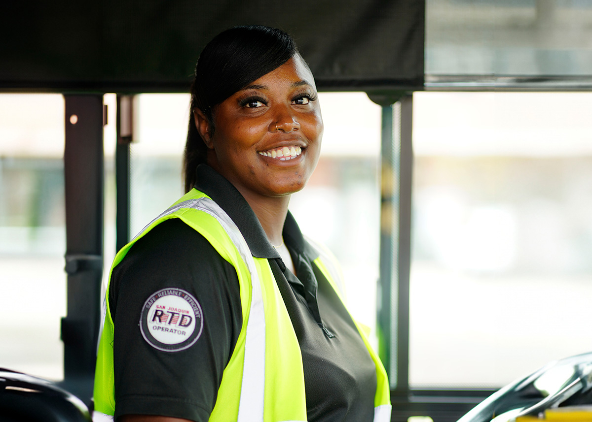Image of a bus operator driving a bus