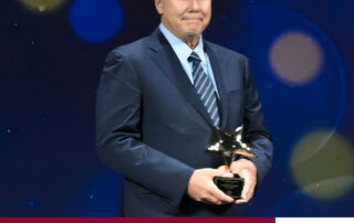 Image of San Joaquin RTD CEO Alex Clifford holding an AdWheel Award