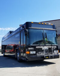 A RTD Commuter bus traveling on a highway.
